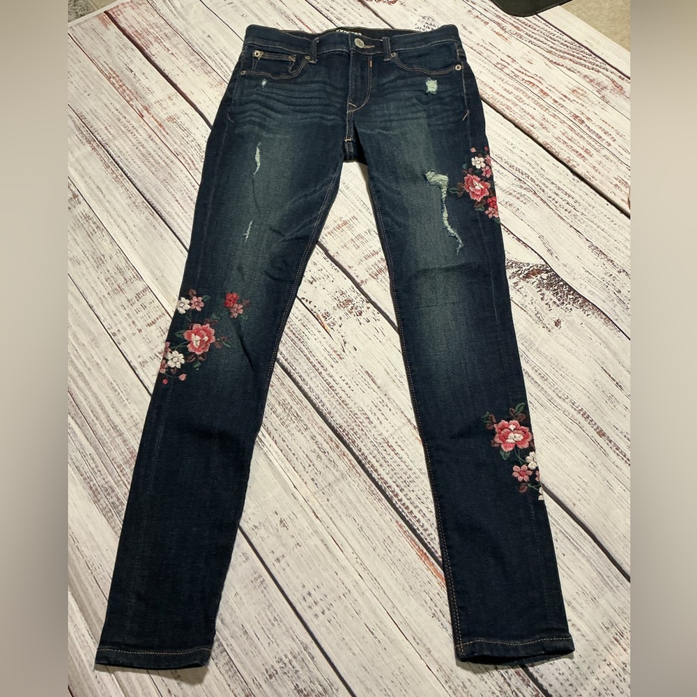 Express Mid Rise Legging with Floral design on jeans. Size 2R.